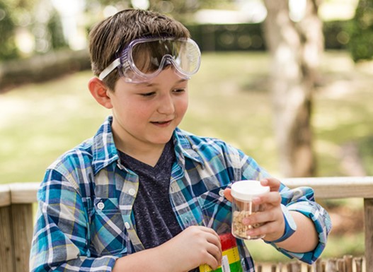 Child playing with experiments