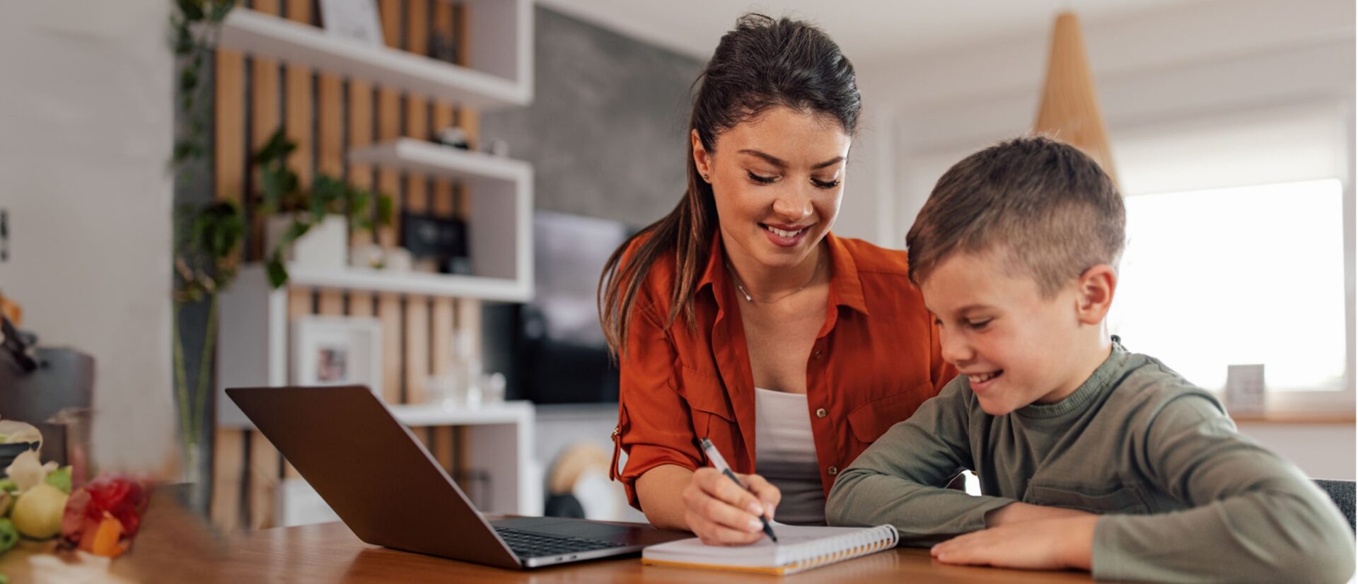 Mother and son doing homework together