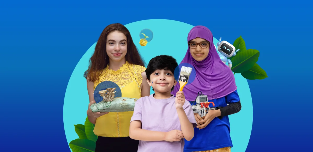 A girl with an art project, a boy holding a brush and another girl holding a small robot